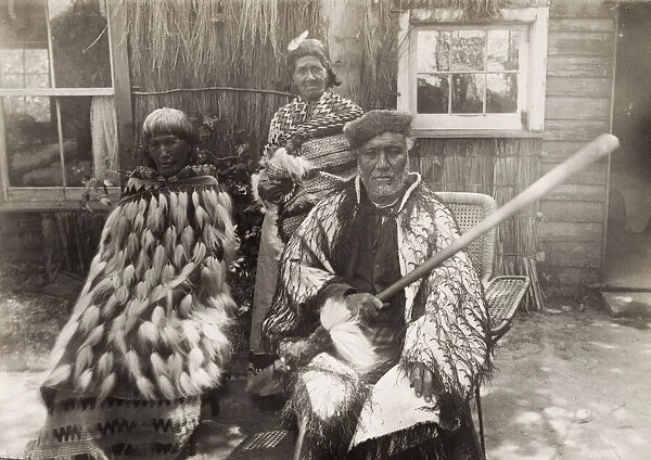 19th century vintage photograph: Maori group, man with club, New Zealand, c. 1890