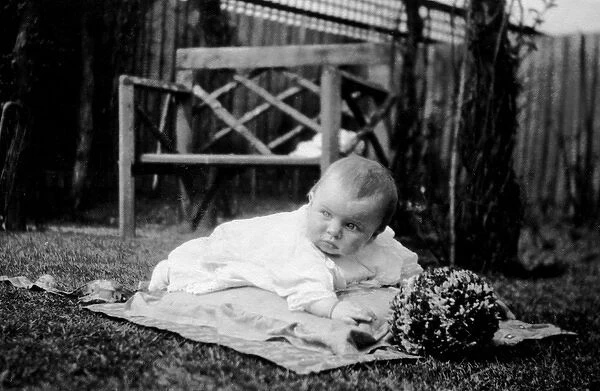 Baby lying in the garden
