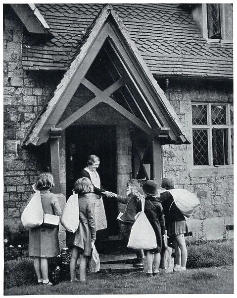 Evacuees receive their kit bags in the country 1939