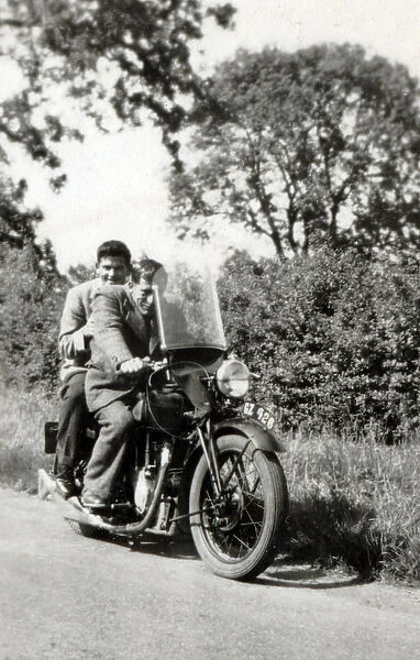 Two men on 1935 Velocette motorcycle