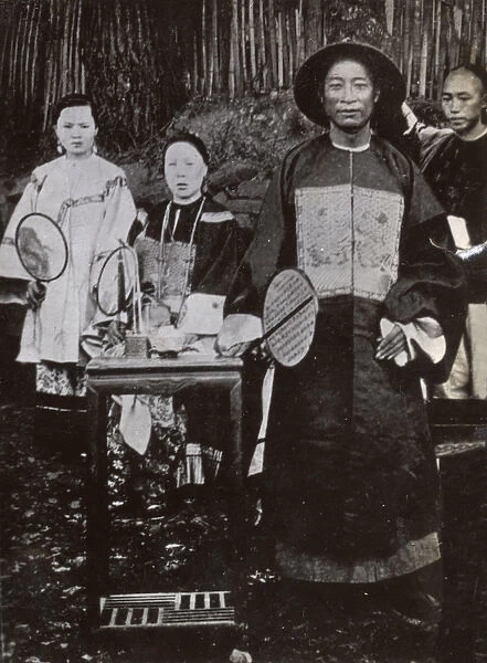 Men and women in traditional costume, China