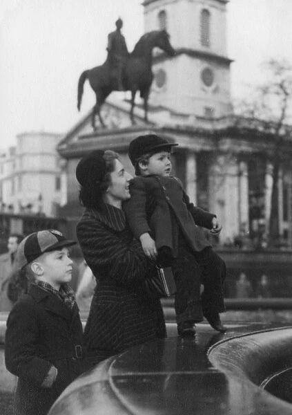 Mother and her two boys in Trafalgar Square, London - 1950s