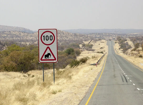 Africa, Namibia, Etosha National Park. Speed limit and elephant caution sign. Credit as
