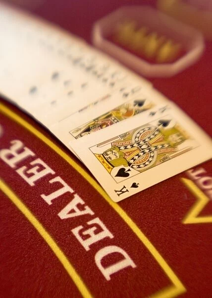 French Polynesia. A deck of cards fanned out on a casino table aboard Paul Gaugin cruise ship