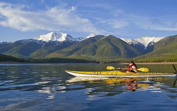 Kayaking on Hungry Horse Reservoir with Great Northern Mountain in background in