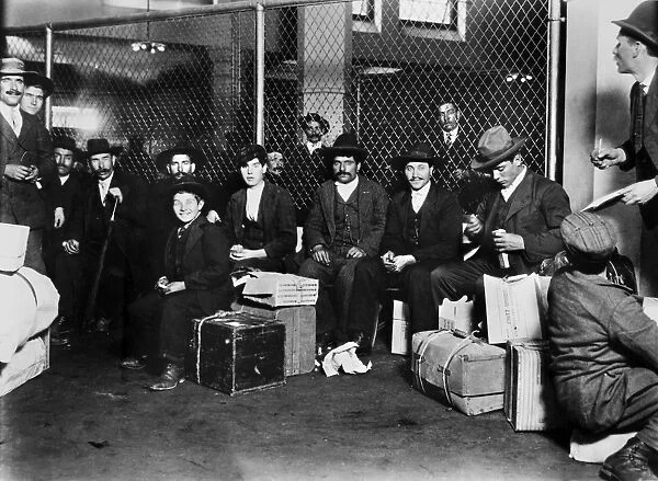 IMMIGRANTS: ELLIS ISLAND. A group of Italian men and boys at Ellis Island