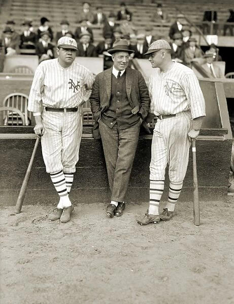 RUTH, DUNN AND BENTLEY. American baseball players Babe Ruth and Jack Bentley in New York Giants uniforms for an exhibition game. Between them is pitcher Jack Dunn. Photograph, 1923