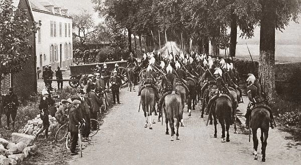 WWI: BELGIUM, 1914. French lancers passing through a small town in Belgium. Photograph