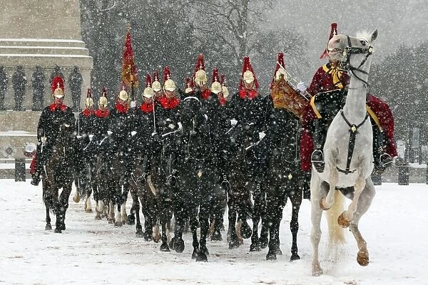 Snow spooks horse at the Changing of the Queens Life Guards, London