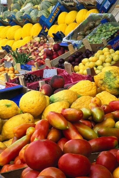 Italy, Sicily, Noto, variety of fresh fruit products on market stall