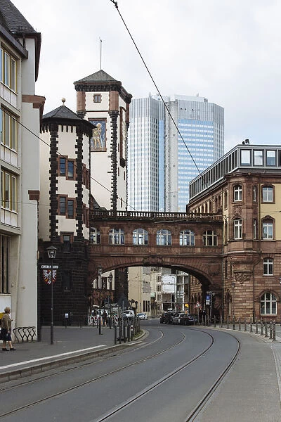 Bridge of Sights (SeufzerbrAOEcke) in the historic center and modern skyscraper in the background in Frankfurt am Main, Hesse, Germany