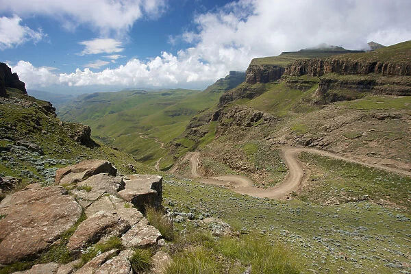 A scenic view of the a trail through the hills of the Sani Pass, Drakensberg Park, KwaZulu-Natal, South Africa