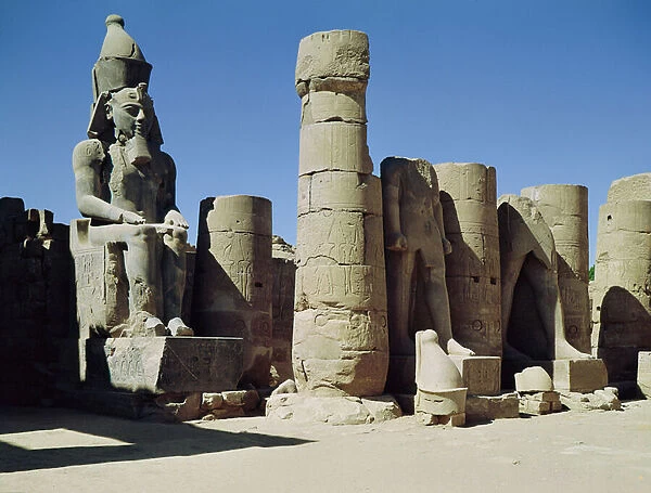 Seated statue of Ramesses II (c. 1279-1213 BC) in the Peristyle Court, New Kingdom (photo)