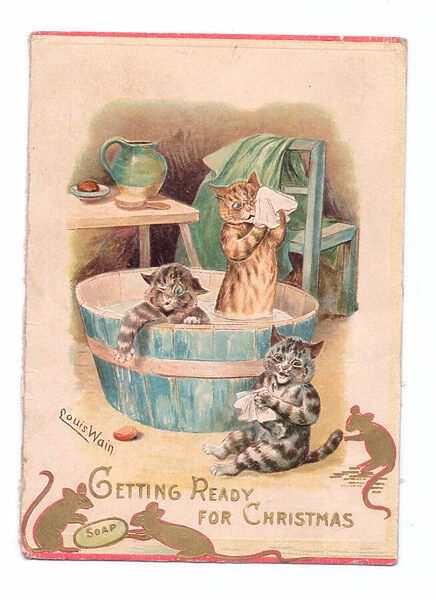 A Victorian Christmas card of two cats in a bathtub while two mice play with a bar of