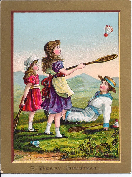 A Victorian Christmas card of two girls and a boy playing badminton, c