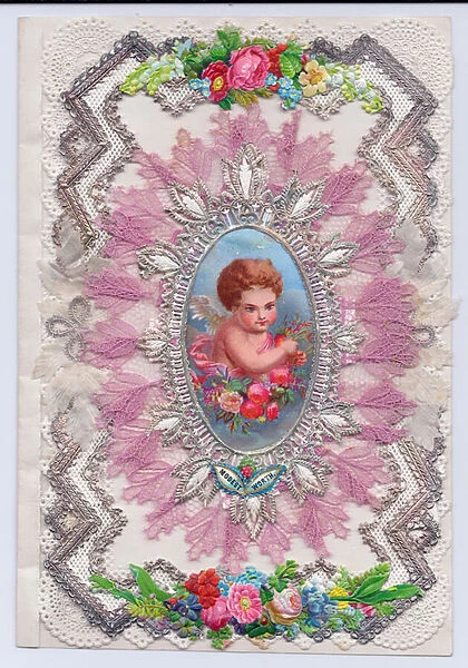 A Victorian decoupage embossed paper lace greeting card with cupid surrounded by fabric