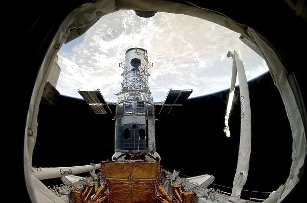 The Hubble Space Telescope, locked down in the cargo bay of Space Shuttle Atlantis