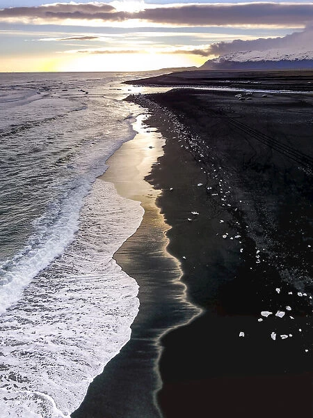 Aerial view of ice from the Jokulsarlon Glacier Lagoon on a black sand beach, Iceland