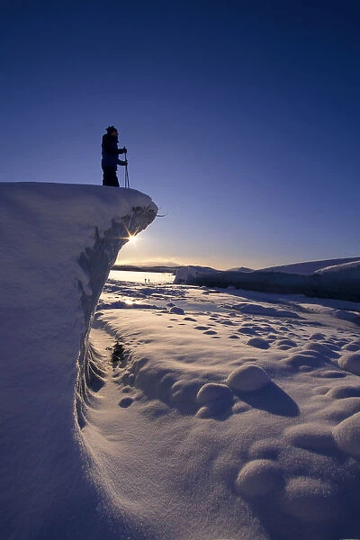 Alaska, Juneau, Mendenhall Glacier, Nordic Skier Stands On Cliff At Sunset B1661