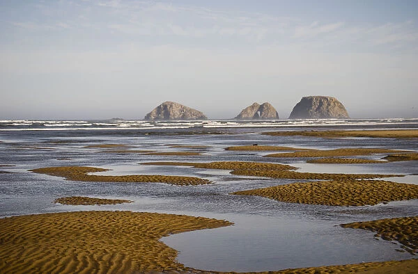Three Arch Rocks Are Viewed From The Mouth Of Netarts Bay; Netarts, Oregon, United States Of America