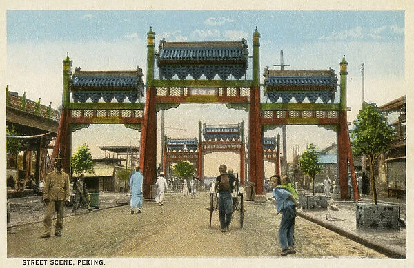 Archival colour postcard of street scene, Peking (Beijing), China, with entry gates, circa 1910