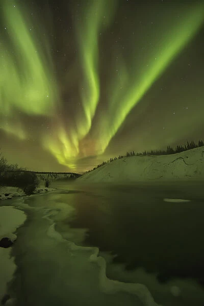 Aurora Borealis Over The Yukon River; Yukon Canada
