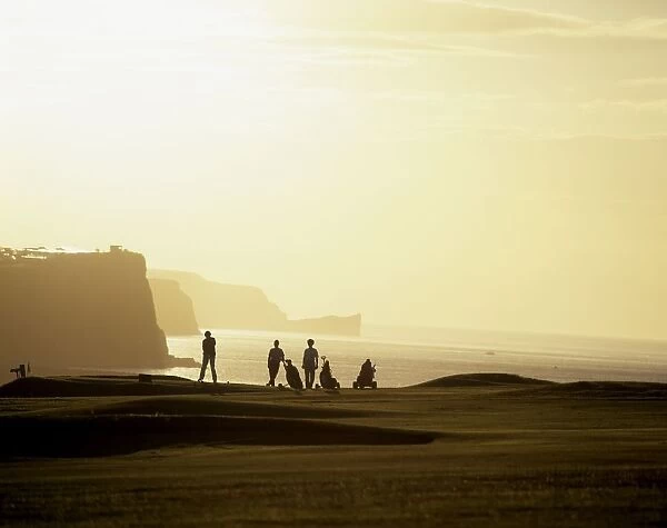 Ballycastle Golf Club, Co Antrim, Ireland; Silhouetted People Playing Golf