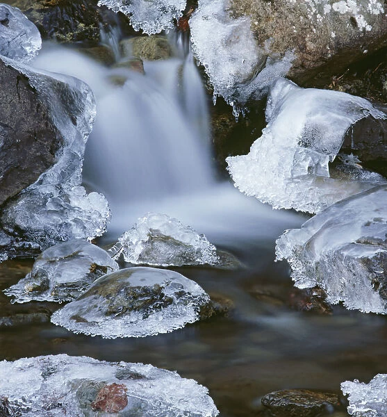 Blurred Motion Of Creek Surrounded By Ice Sc Alaska