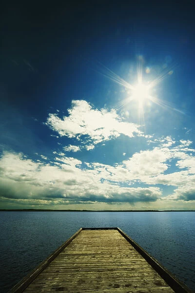 Bright Sun Over Dock On Lake