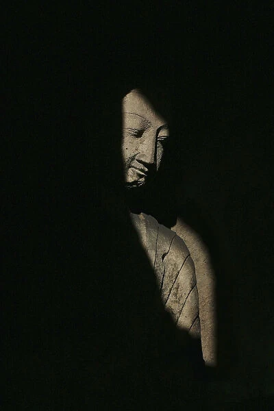 Buddha Statue In Shadows, Yungang Caves, Wuzhou Shan Mountains, China