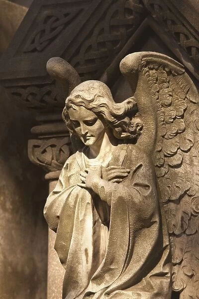Buenos Aires, Argentina; A Stone Statue Of An Angel In Recoleta Cemetery