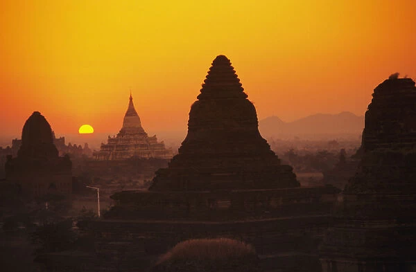 Burma (Myanmar), Bagan, Shwesandaw Paya, Temples Silhouetted Against Orange Sunset