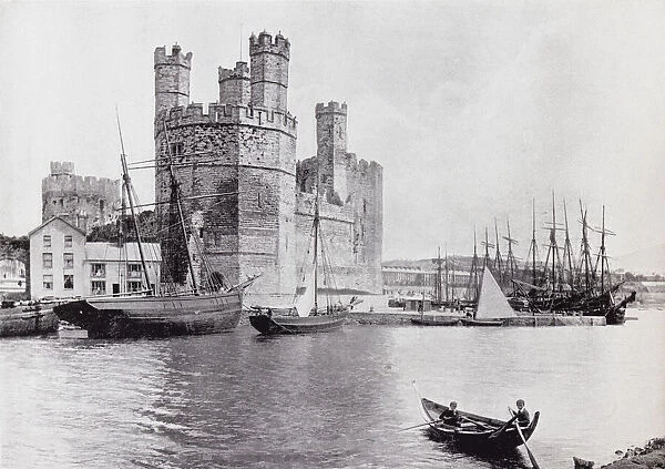 Caernarfon Castle, aka Carnarvon Castle or Caernarvon Castle, Caernarfon, Gwynedd, north-west Wales, seen from across the River Seiont in the 19th century. From Around The Coast, An Album of Pictures from Photographs of the Chief Seaside Places of Interest in Great Britain and Ireland published London, 1895, by George Newnes Limited
