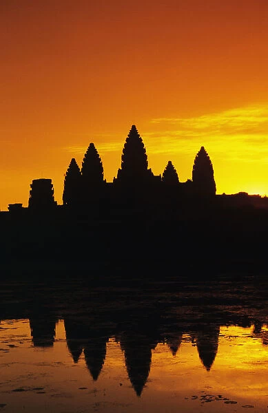 Cambodia, Siem Reap, Angkor Wat, Silhouette Of Temple At Sunrise, Reflections On Water Surface, Ornage Sky