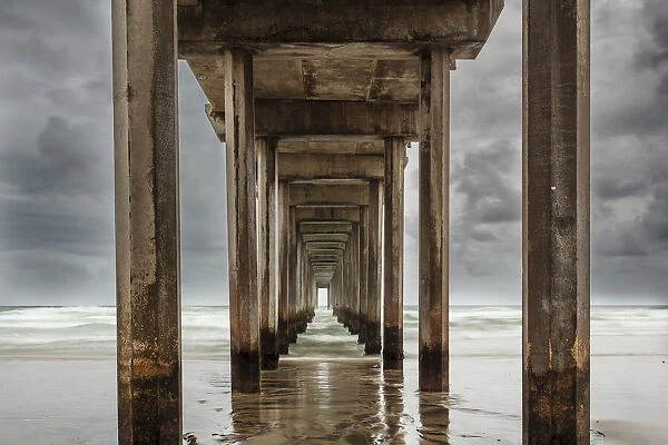 Cement columns under Scripps Pier in the Pacific Ocean, La Jolla, California, USA