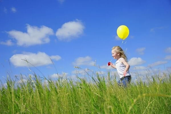 Child Running With A Balloon