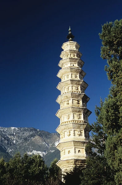 China, View of pagoda with mountain in background; Dali