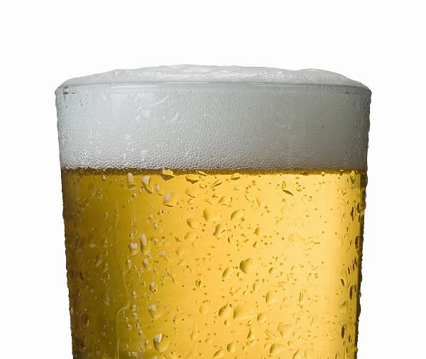Close-Up Detail Of Beer In Wet Glass