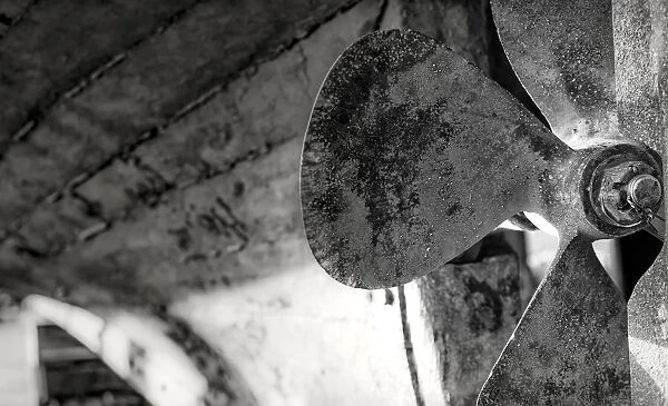 Close-Up Black And White Image Of The Blades Of A Boats Rusted Propeller; Seahouses, Northumberland, England
