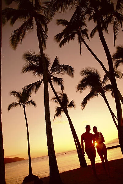 Close-Up Of Couple In Park Heads Together, Palm Trees Silhouetted By Sunset