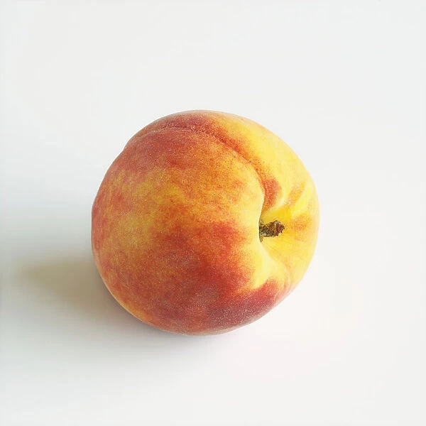 Close-Up Of Ripe Peach On White Background
