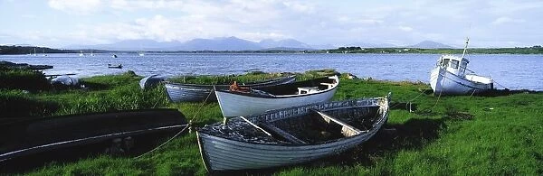Connemara, Co Galway, Ireland; Boats Near The Water