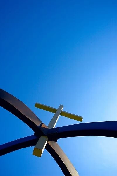 A Cross Suspended In Arches