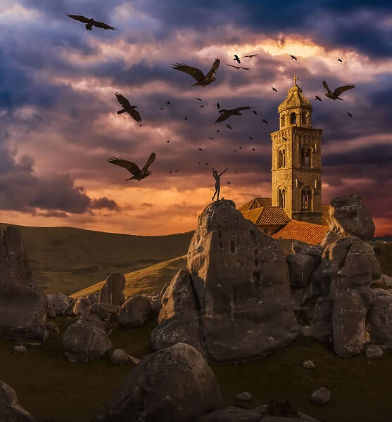 Crows flying towards a church tower