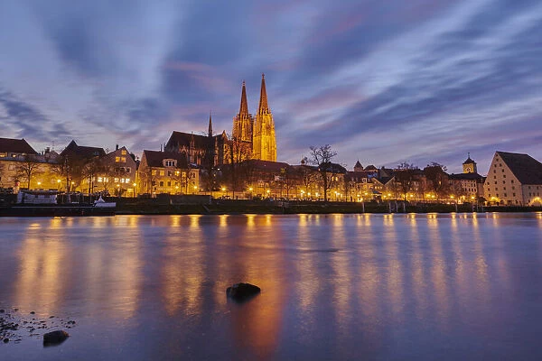 Danube River and St Peters Cathedral in the Old Town of Regensburg at dusk, Bavaria, Germany