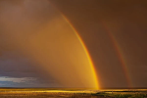 Double Rainbow Over A Prairie Field After A Storm; Val Marie, Saskatchewan, Canada