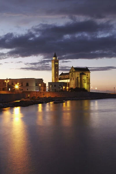 A dusk view of the fishing harbor of Trani