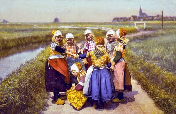Dutch children in traditional clothes including wooden clogs, photomechanical print dated to 1900