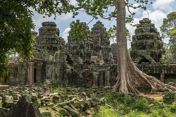 Fallen rocks and trees behind ruined temple, Banteay Kdei, Angkor Wat, Cambodia