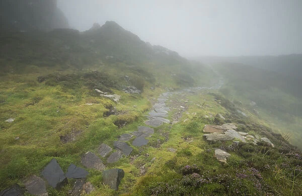 Fog along a stone path at the Slieve League cliffs in County Donegal, Ireland